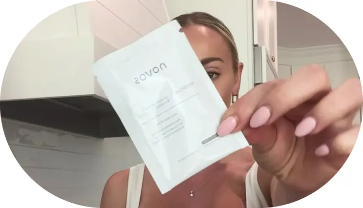 Customer holding a NOVOS Core sachet